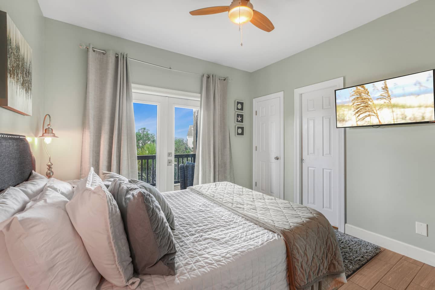 Keep the curtains open and let the porch be part of the room: your own TV, closet space, and the outside a step away.