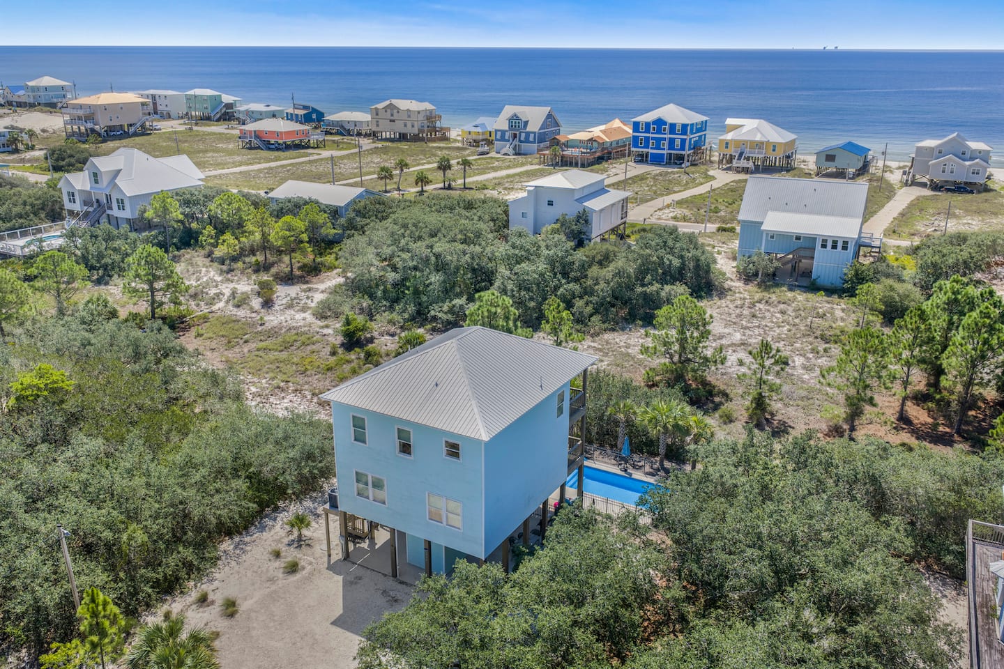 Spot your pool from the air: the water a few rows past your roof, the beach a short stroll straight down the street.