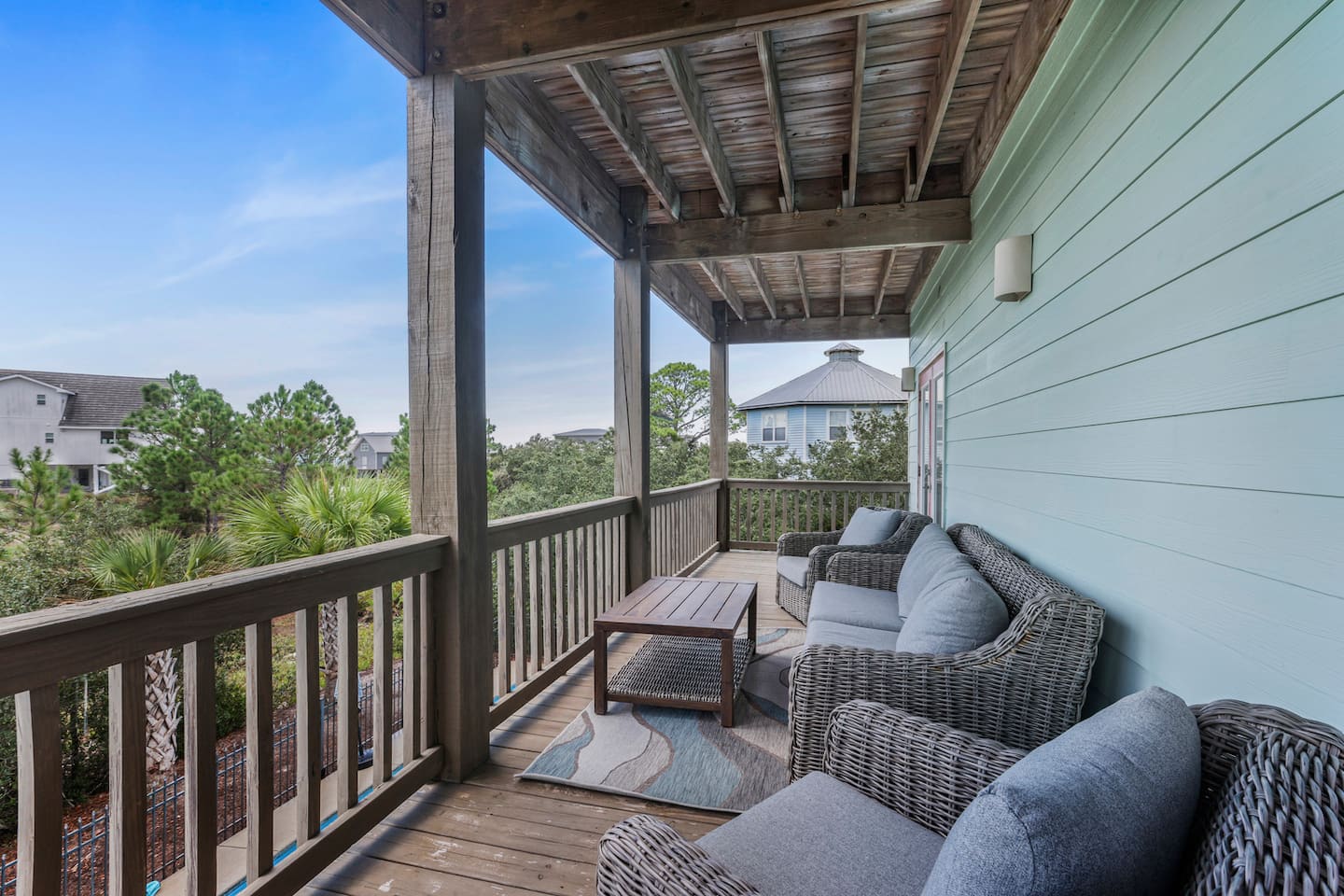 Sink into the outdoor sectional on the upper deck with a book you'll never finish: treetops at eye level and the sea breeze doing the work.
