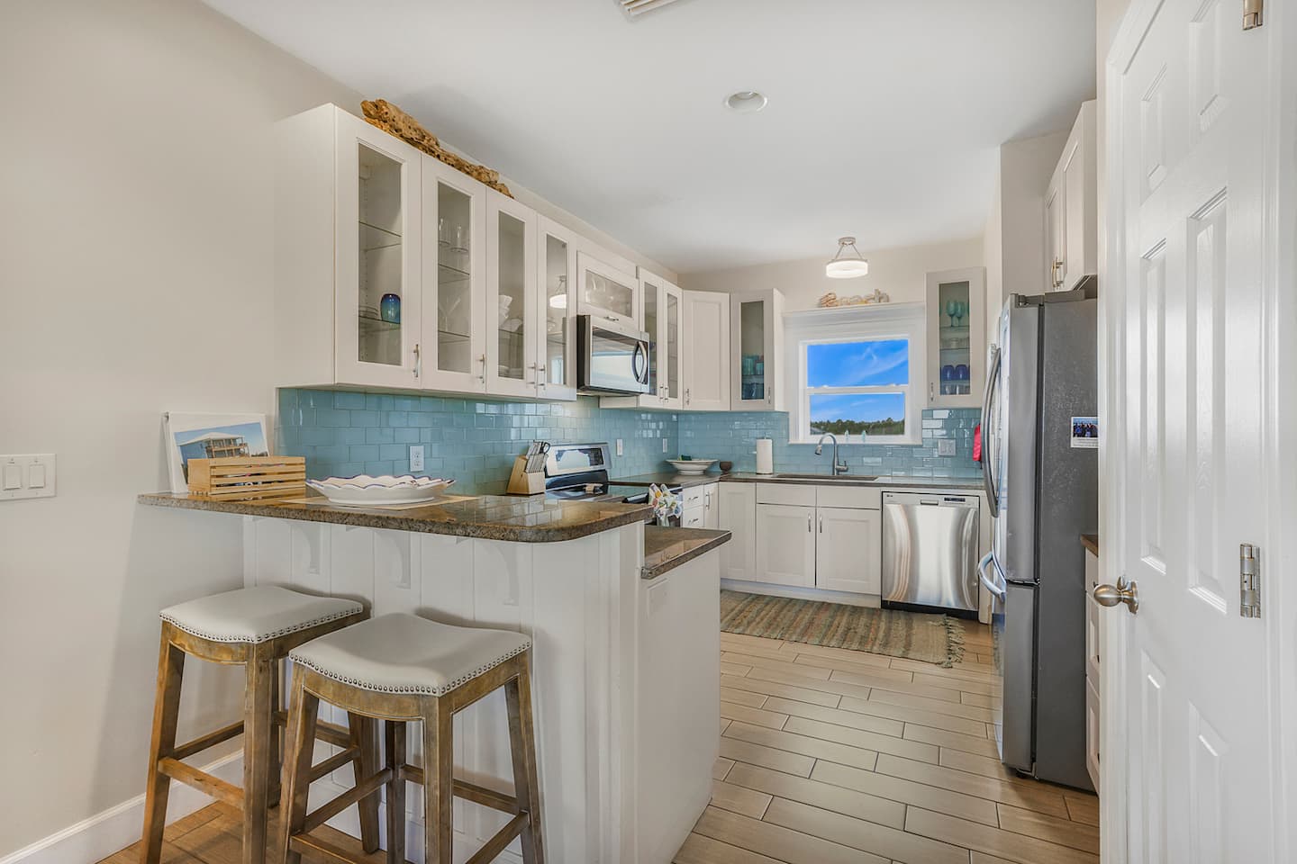 Pull up a stool at the bar and keep the cook company: coffee in the morning, drinks before dinner, the whole kitchen open to the rest of the house.