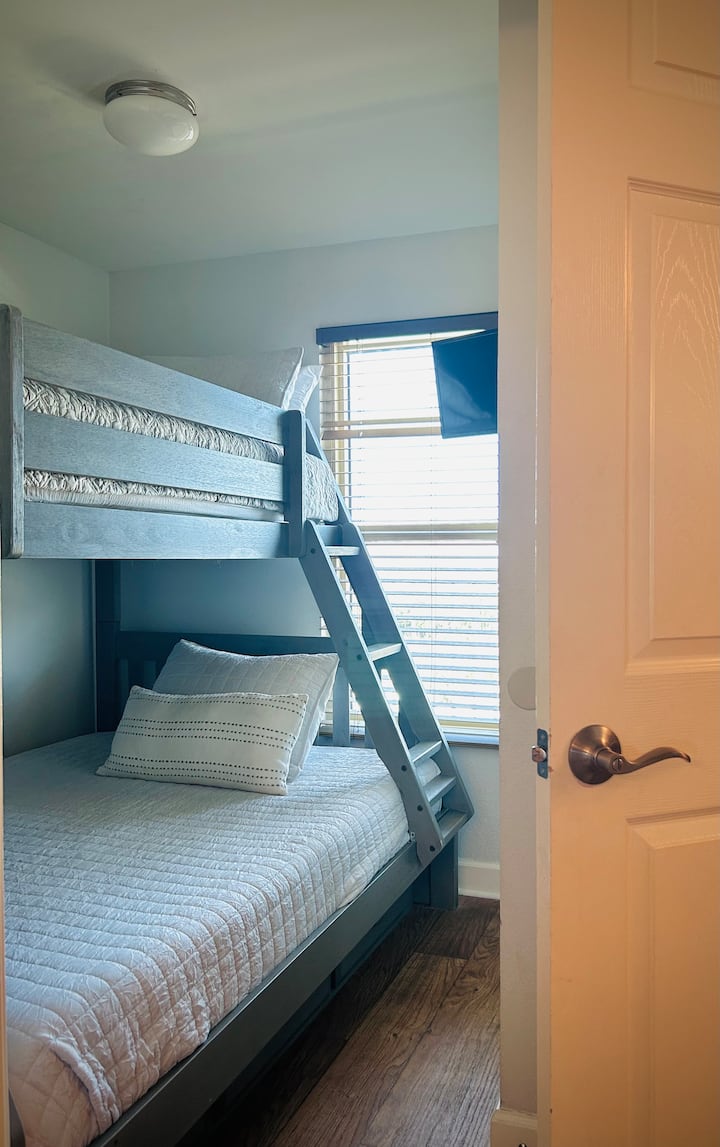 Bunk bedroom #2. Full bed on bottom. Bunk room has a door and closet and an adjoining bath