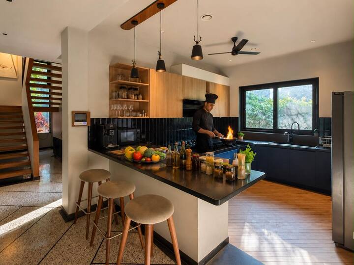This image is for visual reference only. Personal chef service is available on request at an additional charge. The villa, kitchen and amenities shown are genuine; the actual chef and setup may vary.