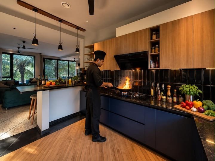 This image is for visual reference only. Personal chef service is available on request at an additional charge. The villa, kitchen and amenities shown are genuine; the actual chef and setup may vary.