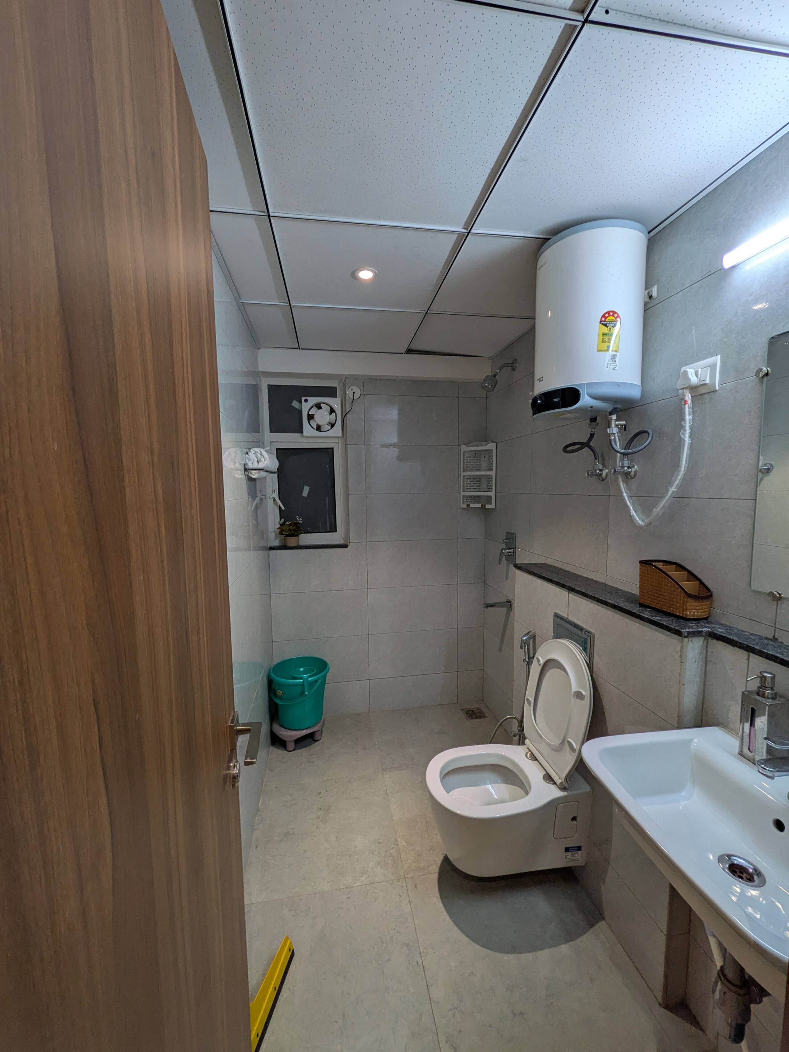 Bathroom one with geyser, WC and basin