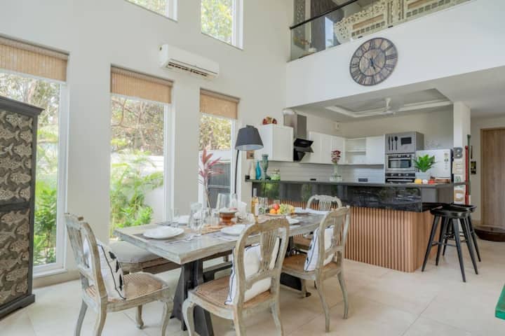 Modern dining meets sleek kitchen design for an inviting culinary experience.