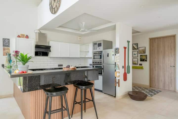 Modern dining meets sleek kitchen design for an inviting culinary experience.