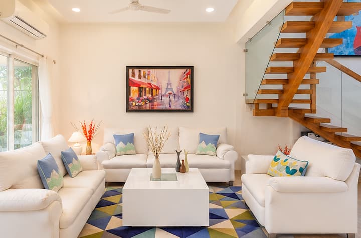 With its high ceilings, warm lighting, tasteful décor, and staircase adding architectural character, this home offers a welcoming setting for both short getaways and extended stays.