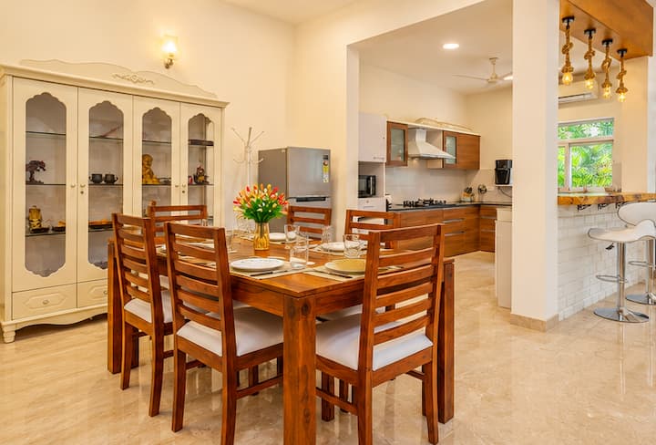 Enjoy meals and memorable moments around a beautiful wooden dining table with seating for six.
