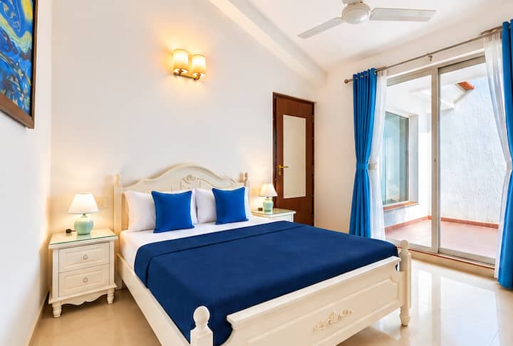 Experience comfort and elegance in this beautifully appointed bedroom, where modern design meets warm, natural elements.