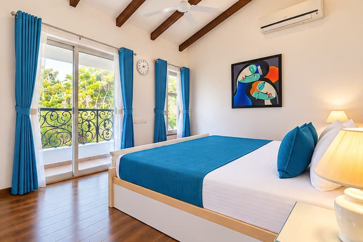 Relax in this beautifully designed bedroom, featuring a comfortable bed dressed in crisp white linens and vibrant teal-blue accents.