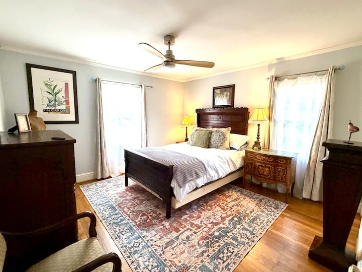 Our gorgeous front bedroom boasts an 1890s  queen walnut historic bed that we converted into a queen.