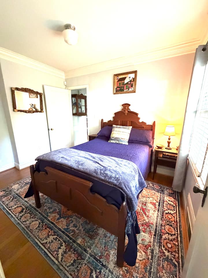 The third bedroom has a great view of the animals and the gardens and features this 1890s walnut 3/4 bed.