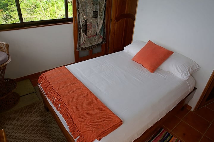 Tree House feel from this room.  A full sized bed, large windows and fans…this room was originally a balcony that we closed in and made a bedroom.  It connects to bedroom 4 with a screen and solid door but better airflow for both rooms when open