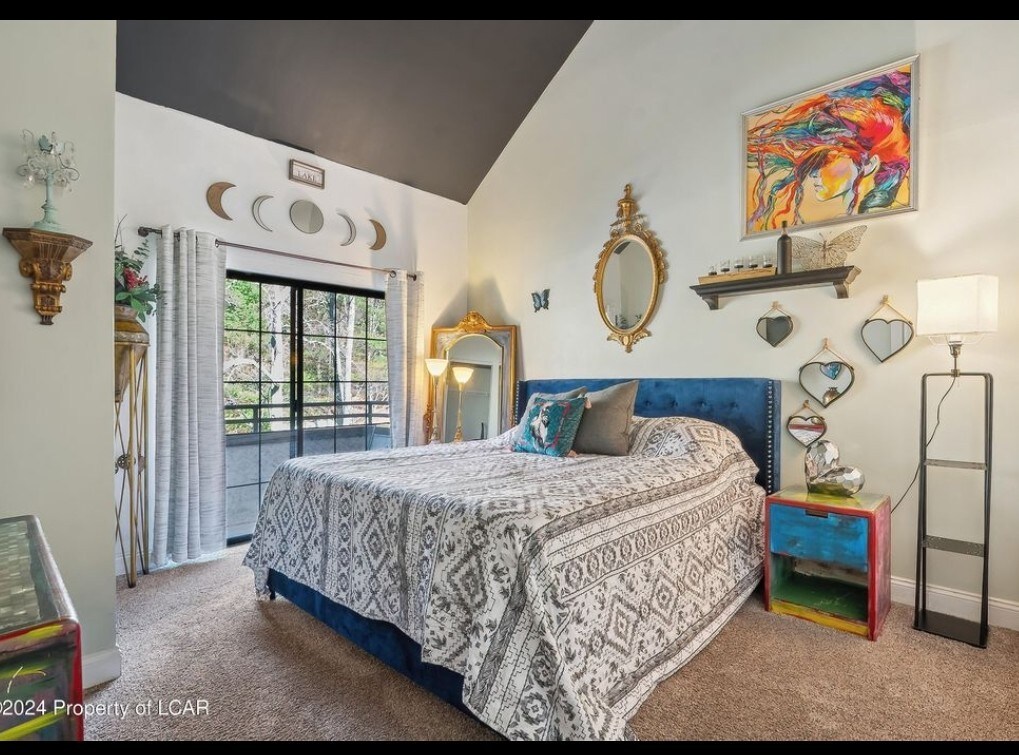 Bedroom 1 with its own full bathroom and balcony