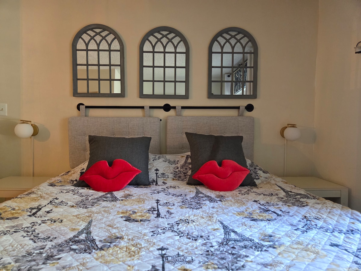 King bed with its own full bathroom with tub/shower