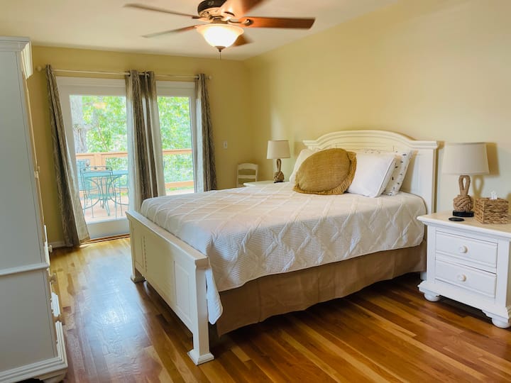 Bedroom on 2nd floor with private deck.  Ceiling fan, queen bed, fire TV, closet, blinds and curtains.