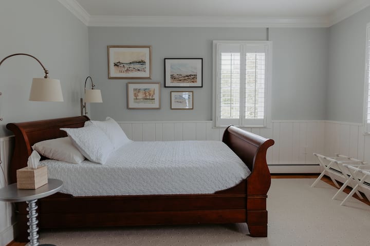 Queen bed, waterfront view from side window. Artwork by Carolyn Connell.