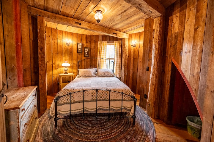 Third floor silo bedroom with queen bed. 