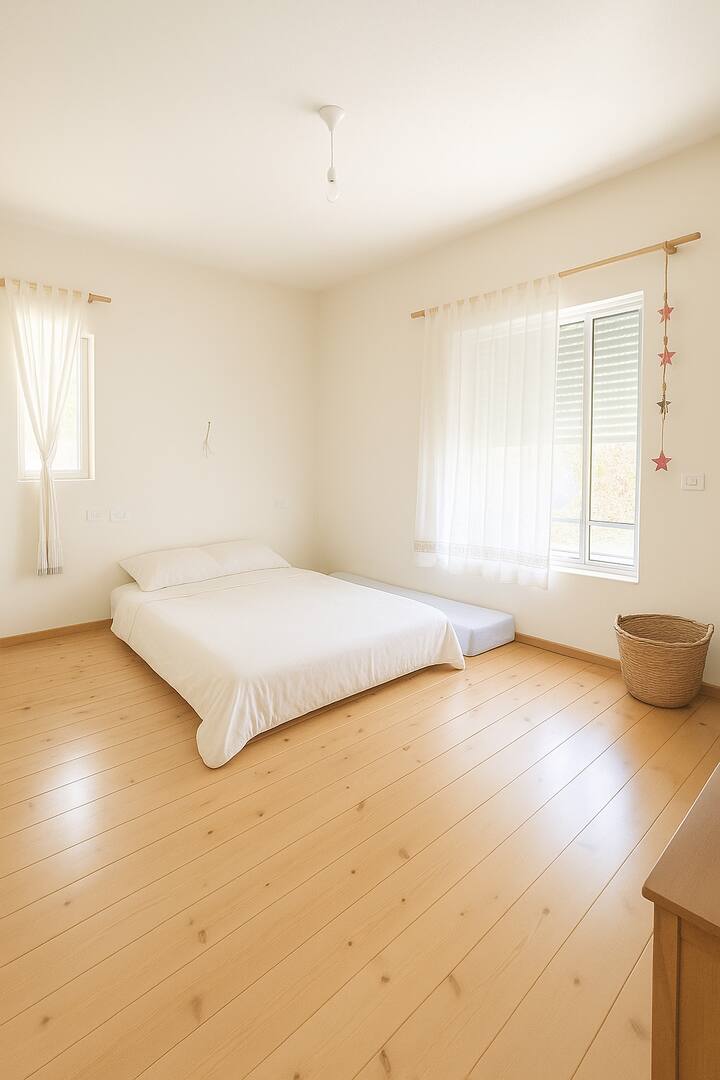 Master bedroom with double bed, a mattress can be added as a connecting bed for a baby or toddler, and there is plenty of room for additional mattresses 