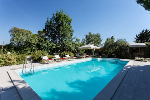 Apartment surrounded by greenery and private pool