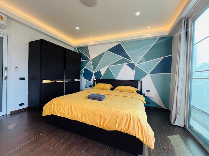 Master bedroom with king, bed and bunk and private bathroom with bath tube