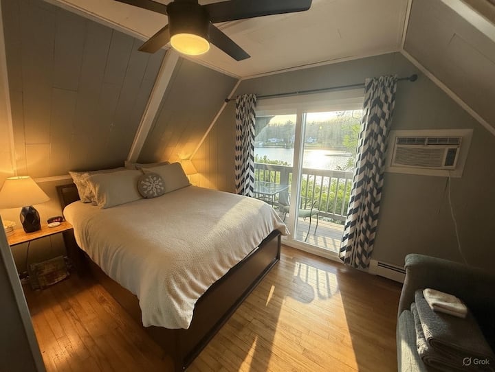 Master bedroom with private Balcony and seating outside.  Cozy with amazing views