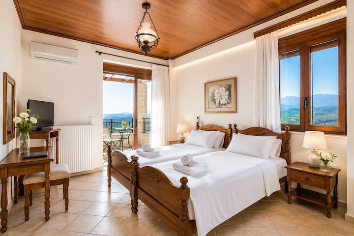First Floor - Bedroom 4 with three single beds, ensuite bathroom with hydro-massage shower and private balcony with sea view.