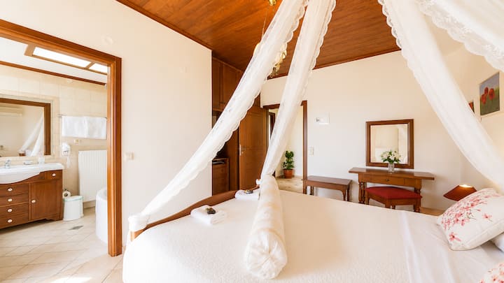 First Floor - Bedroom 3 with queen bed, ensuite bathroom with jacuzzi bathtub and private balcony with sea view.