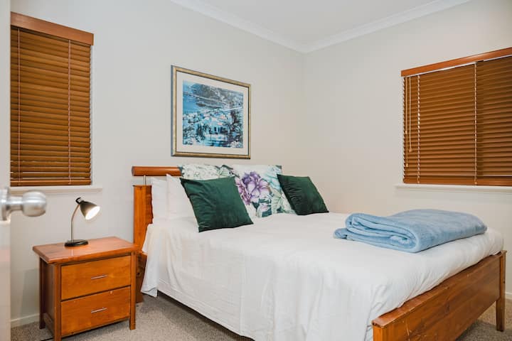 Queen sized bed and double wardrobe.