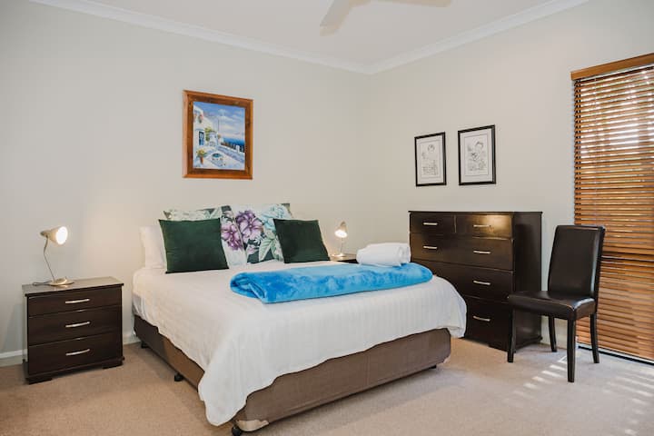 Master bedroom with Queen sized bed and ensuite bathroom.