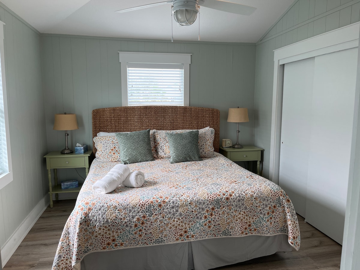 great king bed space with full bath just outside the room.