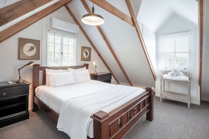 Upstairs bedroom with a queen bed.