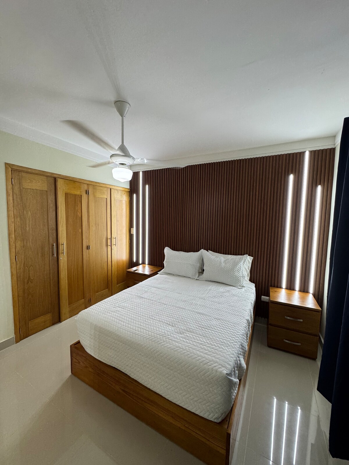 Bedroom with Queen size bed and air conditioner 
