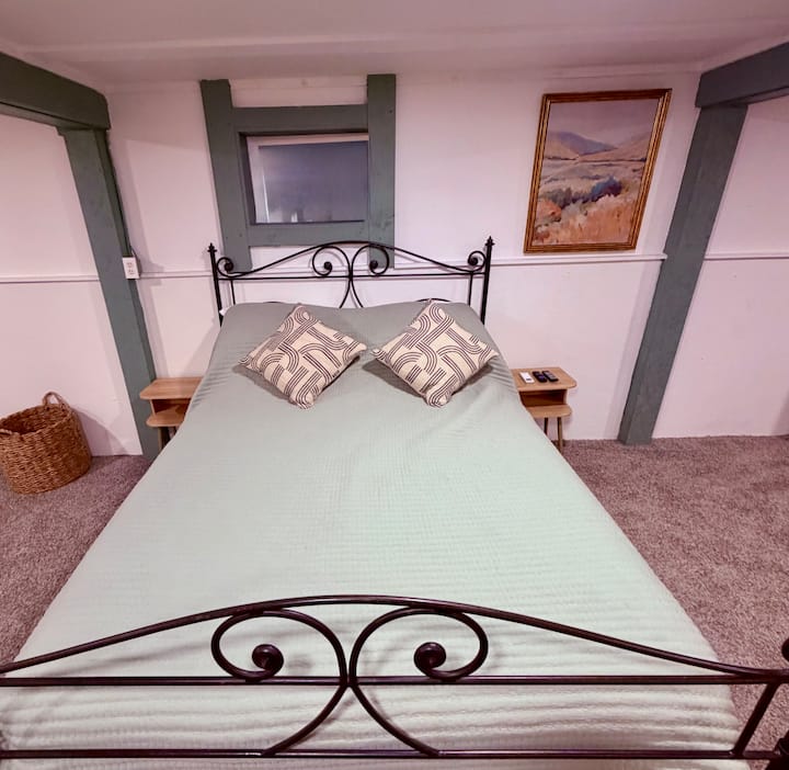 First floor bedroom with queen sized bed. Very spacious room with a TV.