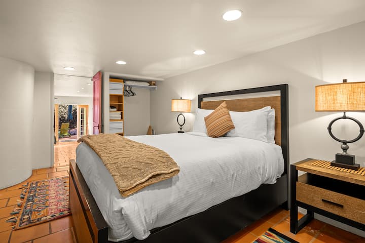 Step up a couple stairs from the living room into this cozy bedroom.