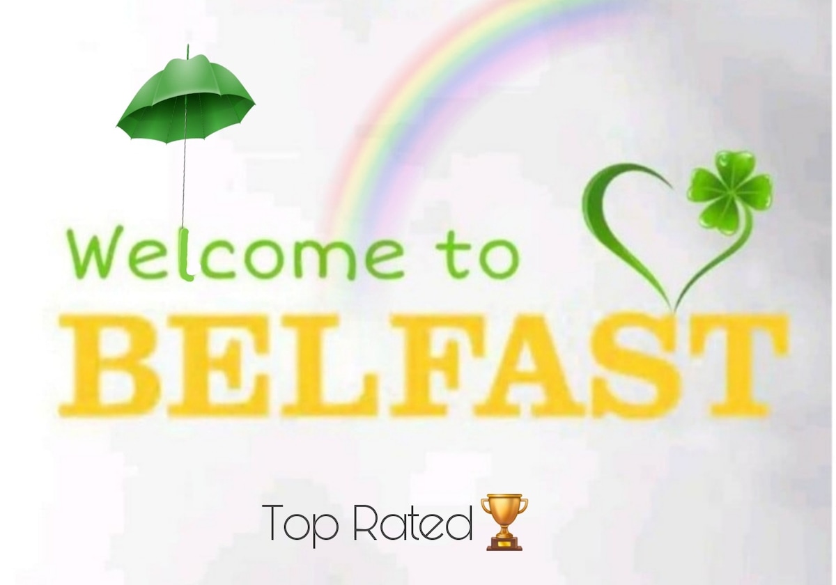 A welcoming graphic features the text 'Welcome to Belfast' in bright yellow. Above, a green umbrella hovers alongside a rainbow and a clover symbol, representing local culture and charm. The phrase 'Top Rated' is accompanied by a trophy icon, indicating high guest satisfaction.