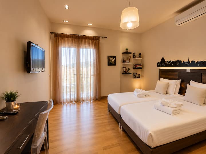 Main Level - Bedroom 2 with two single beds (can be joined into a king-size bed upon request) and direct access to the veranda