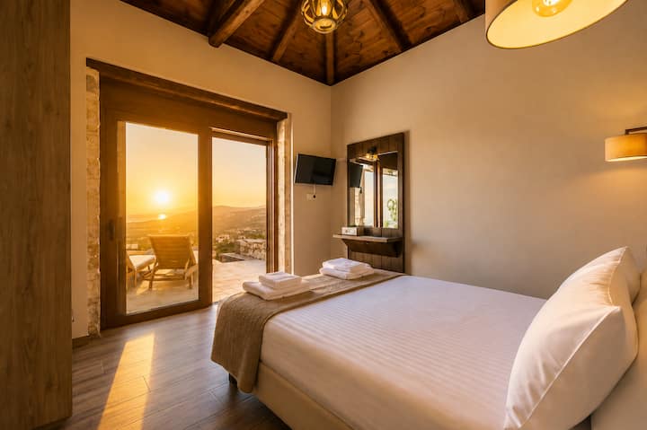 Bedroom 2 with a queen-size bed and direct access to the pool terrace.