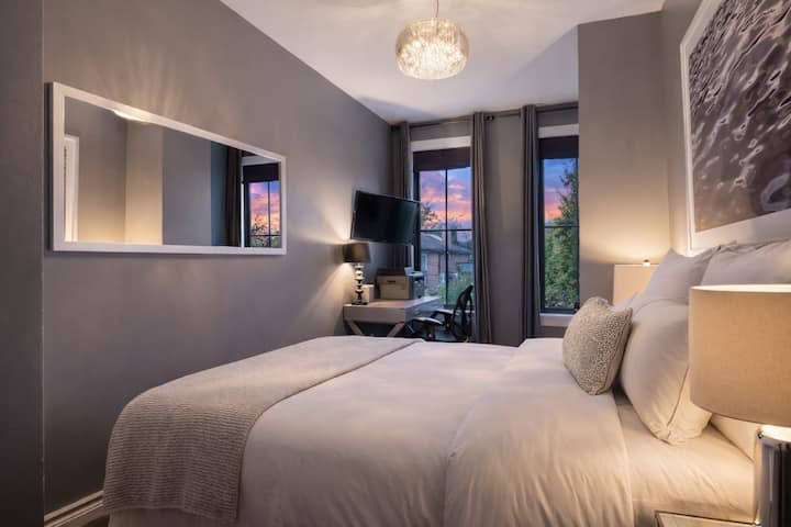 The second bedroom is outfitted with Queen-sized bed, blackout curtains, Italian Parcal sheets, and overlooks the garden.