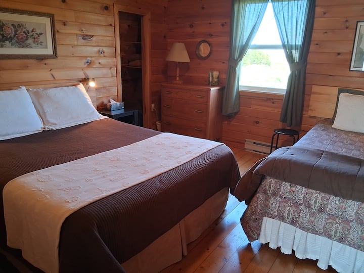 The second bedroom has a queen and a cozy single bed. There are even books for all ages in the nightstands!