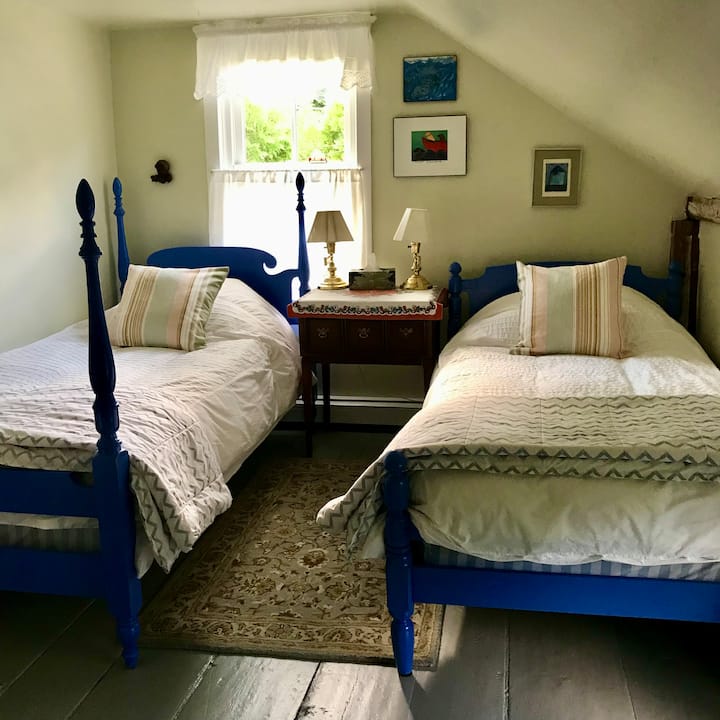 Two twin size beds are in this adjoining bedroom.