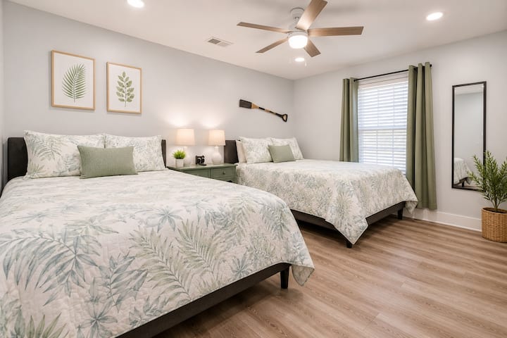 First bedroom, two queen beds and a private bathroom