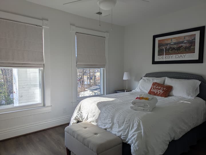 This bedroom has a queen bed and 2 nightstands