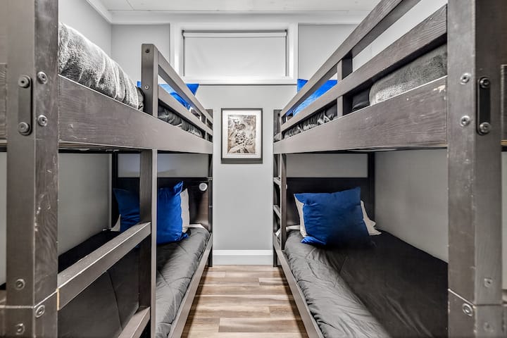 Bunk room with 4 single beds. Great for the kids!