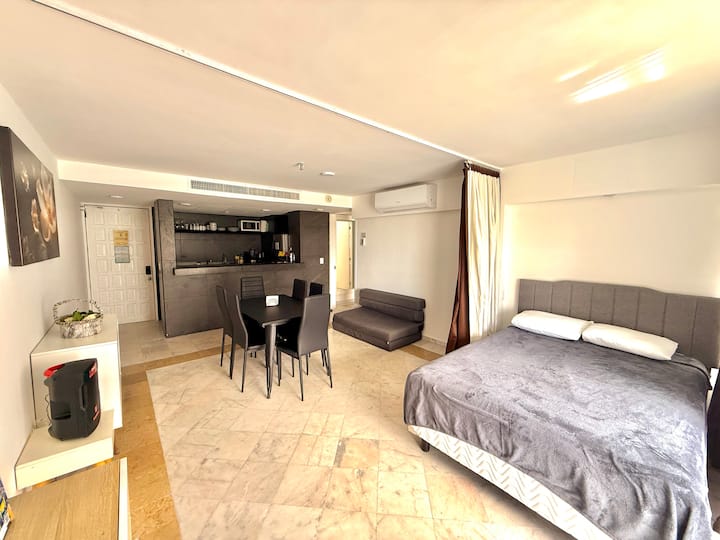 Double bed next to the dining room with privacy curtain