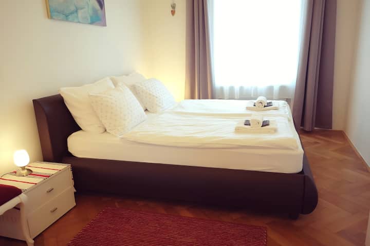 King size bed in a cozy bedroom