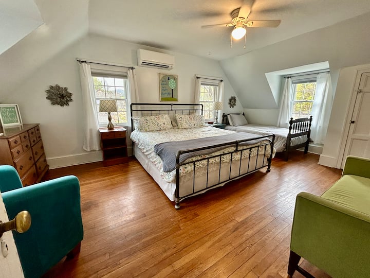 Upper level bedroom 1 with king bed and twin bed.