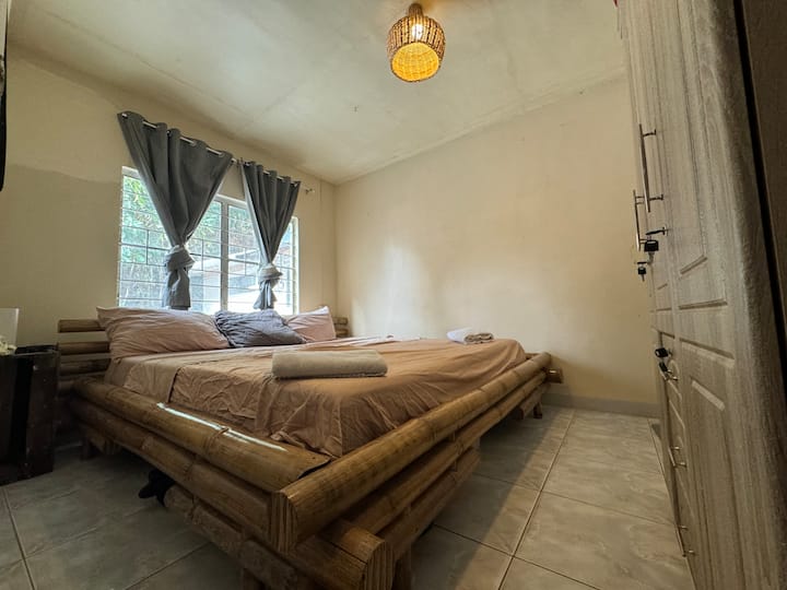 King size bamboo bed (2m x 2m) with air dehumidifier.