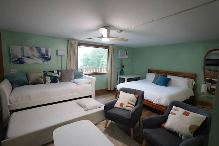 Games Room with King bed, 2 twin beds and a twin sofa bed.