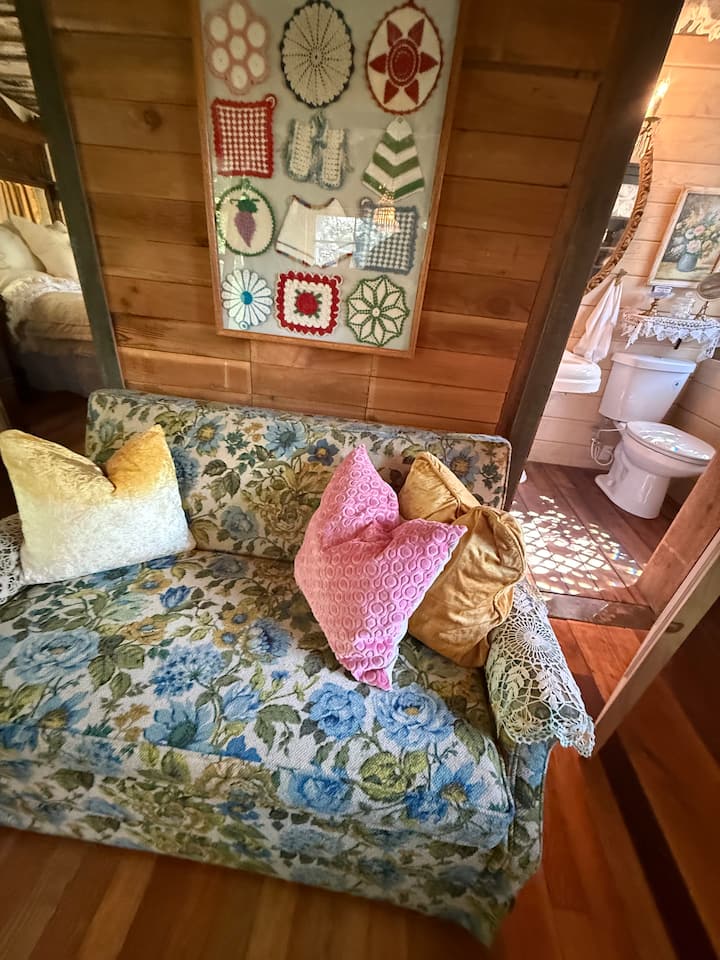 This cutie patootie vintage couch does double duty as the most comfy twin bed.  The pullout mechanism is still  smooth as butter with minimal effort.